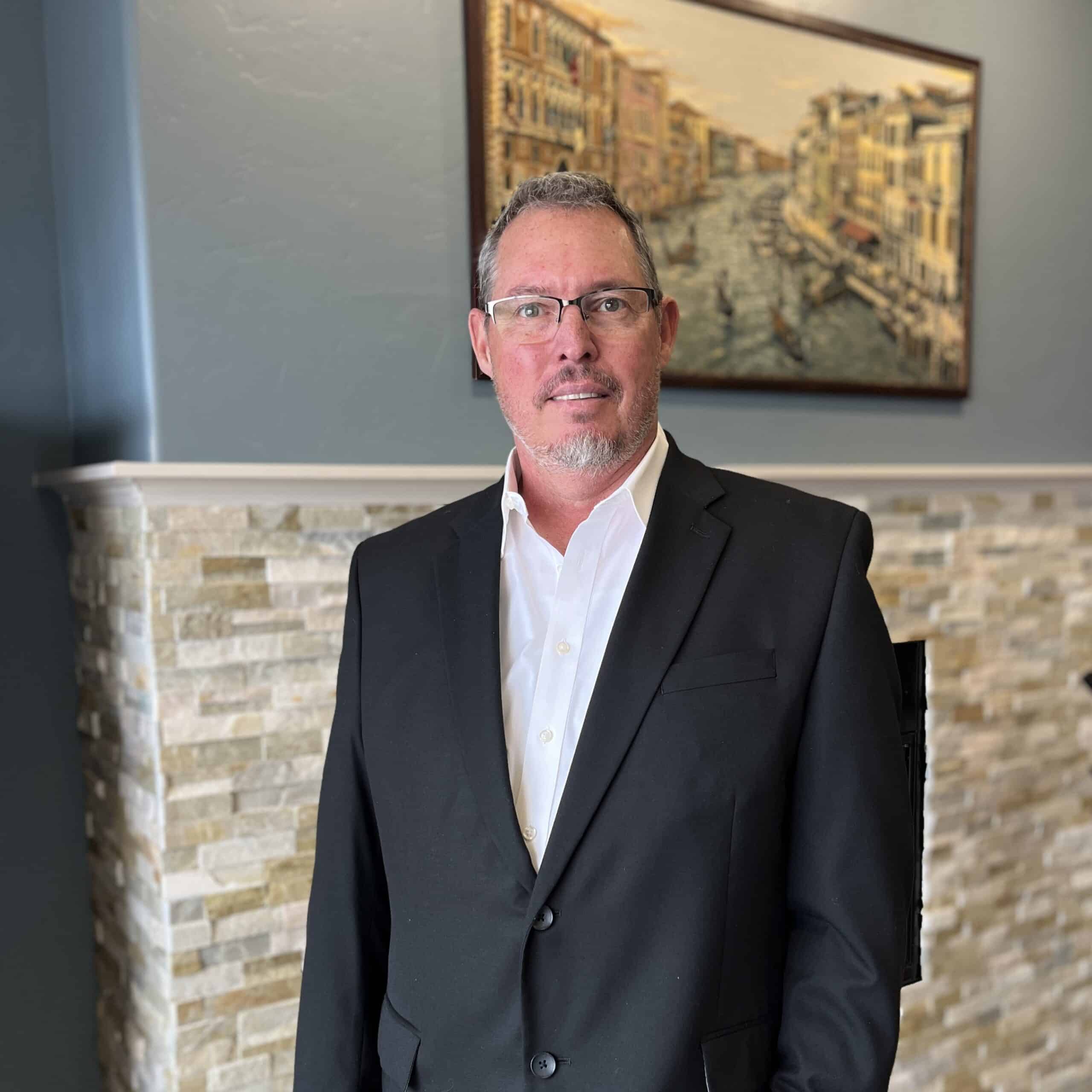 Professional headshot of Shaun Wilson, Fractional CMO and AI Search Optimization strategist